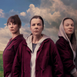 a group of women standing in a field